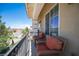 Relaxing balcony with cushioned seating and views of the surrounding neighborhood at 9450 Niagara Landing St, Las Vegas, NV 89139