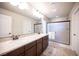 Bathroom boasting double sinks, a shower, and marble countertops at 9450 Niagara Landing St, Las Vegas, NV 89139