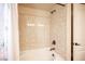 Bathtub with shower head and tiled wall at 9450 Niagara Landing St, Las Vegas, NV 89139