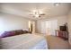 Comfortable bedroom with neutral walls, carpeted floor and couch at 9450 Niagara Landing St, Las Vegas, NV 89139