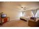 Spacious bedroom featuring neutral walls, ceiling fan, and carpeted floors at 9450 Niagara Landing St, Las Vegas, NV 89139