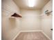 Walk-in closet with built-in shelving and carpeted floors at 9450 Niagara Landing St, Las Vegas, NV 89139