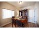 Dining room with wood table, hutch and view of side yard at 9450 Niagara Landing St, Las Vegas, NV 89139
