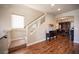 Bright entryway with wood floors, staircase, and decorative furniture and décor at 9450 Niagara Landing St, Las Vegas, NV 89139