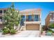 Charming two-story home with a balcony, a two-car garage, and drought tolerant desert landscaping at 9450 Niagara Landing St, Las Vegas, NV 89139