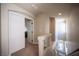 Hallway view with carpeted floors, stairwell and white paneled doors at 9450 Niagara Landing St, Las Vegas, NV 89139