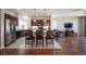 Open floor plan kitchen with stainless steel refrigerator and large island at 9450 Niagara Landing St, Las Vegas, NV 89139