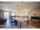The kitchen is spacious and has a large island with seating and dark wood cabinets at 9450 Niagara Landing St, Las Vegas, NV 89139