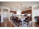 Spacious kitchen features stainless steel appliances, a large island, and dark cabinetry at 9450 Niagara Landing St, Las Vegas, NV 89139