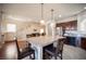 Beautiful kitchen with granite countertops, island seating, and stainless steel refrigerator at 9450 Niagara Landing St, Las Vegas, NV 89139