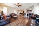Expansive living area with wood floors, comfortable seating, and access to kitchen and upstairs at 9450 Niagara Landing St, Las Vegas, NV 89139