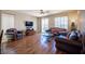 Spacious living room showcases hardwood floors, natural light, and stylish leather furniture at 9450 Niagara Landing St, Las Vegas, NV 89139