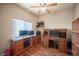Well-lit home office space features hardwood floors, natural light, and a classic ceiling fan at 9450 Niagara Landing St, Las Vegas, NV 89139