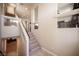 Carpeted staircase with white railings leads to upper level at 9450 Niagara Landing St, Las Vegas, NV 89139