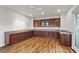 Bonus room featuring wood floors, ceiling fan, and built in cabinets at , Las Vegas, NV 89135