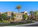 Attractive single-story home with well-maintained landscaping, stone wall, and palm trees at , Las Vegas, NV 89135