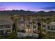 A stunning two-story home featuring a backyard pool, desert landscape, and mountain views in a suburban neighborhood at , Las Vegas, NV 89135