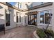 Elegant front entrance featuring a modern door, large windows, and meticulous landscaping at , Las Vegas, NV 89135