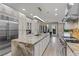Modern kitchen featuring an oversized island, stainless steel appliances, and white cabinetry at , Las Vegas, NV 89135