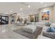 Open-concept living room with stylish decor, a large sectional sofa, and view of the kitchen at , Las Vegas, NV 89135