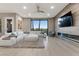 Bright living room with a large sectional sofa, accent chair, and a modern fireplace at , Las Vegas, NV 89135