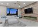 Cozy living room features an electric fireplace, comfortable seating, and a view of the backyard at , Las Vegas, NV 89135