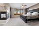 Main bedroom with fireplace, ceiling fan, natural light, and custom headboard at , Las Vegas, NV 89135