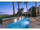 Inviting backyard pool and spa with sun loungers; a perfect oasis for relaxation and entertainment at , Las Vegas, NV 89135