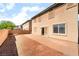 A low-maintenance backyard features a patio and a perimeter wall, offering space and privacy at 100 Samantha Rose St, Henderson, NV 89012