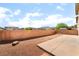 This backyard offers a blank slate for landscaping with a low brick wall along the perimeter at 100 Samantha Rose St, Henderson, NV 89012