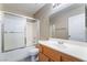 Bathroom features large mirror, shower over tub and sink at 100 Samantha Rose St, Henderson, NV 89012