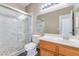 Bathroom with a glass enclosed shower, single sink vanity, and modern fixtures at 100 Samantha Rose St, Henderson, NV 89012