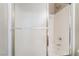 The shower over tub features white glass sliding doors at 100 Samantha Rose St, Henderson, NV 89012