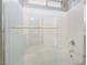 Close up of shower-over-tub features glass doors and shower head at 100 Samantha Rose St, Henderson, NV 89012