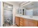 Bathroom vanity with double sinks and a walk-in closet at 100 Samantha Rose St, Henderson, NV 89012