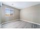 Bedroom features a window with blinds and gray flooring at 100 Samantha Rose St, Henderson, NV 89012