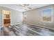 Bedroom featuring plank floors, natural light, and bathroom access at 100 Samantha Rose St, Henderson, NV 89012