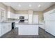 Well-equipped kitchen with an island, granite countertops, and stainless steel appliances at 100 Samantha Rose St, Henderson, NV 89012