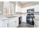 Modern kitchen features new countertops, stainless steel appliances, and ample counterspace at 100 Samantha Rose St, Henderson, NV 89012