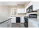 Modern kitchen features new countertops, a gas range, and stainless steel appliances at 100 Samantha Rose St, Henderson, NV 89012