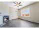 A comfortable living room with fireplace, ceiling fan, and natural light through shuttered windows at 100 Samantha Rose St, Henderson, NV 89012