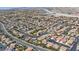 Panoramic aerial view of a residential neighborhood with well-maintained homes and landscaping at 10213 Treasure Mountain Ct, Las Vegas, NV 89129