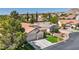 Well-maintained single-story home showcasing lush lawn, landscaping, and a convenient three-car garage at 10213 Treasure Mountain Ct, Las Vegas, NV 89129
