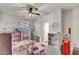 Cozy bedroom with cute decor, including string lights, bed with canopy and a window at 10213 Treasure Mountain Ct, Las Vegas, NV 89129