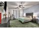 Comfortable bedroom featuring a ceiling fan and neutral decor at 10213 Treasure Mountain Ct, Las Vegas, NV 89129