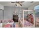 Charming ' bedroom features a cute canopy bed, a dollhouse, and whimsical decor at 10213 Treasure Mountain Ct, Las Vegas, NV 89129