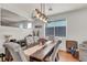 Stylish dining area with a modern light fixture and comfortable seating, perfect for entertaining guests at 10213 Treasure Mountain Ct, Las Vegas, NV 89129