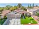 Beautiful single-story home featuring a three-car garage and well-manicured landscaping at 10213 Treasure Mountain Ct, Las Vegas, NV 89129