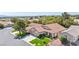 Single-story home featuring mature trees, lush green lawn, and convenient three-car garage in a well-kept neighborhood at 10213 Treasure Mountain Ct, Las Vegas, NV 89129