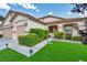 Charming home with a well-maintained lawn and tidy landscaping at 10213 Treasure Mountain Ct, Las Vegas, NV 89129